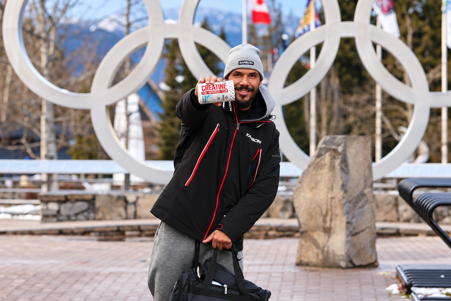Davidson photographed on location beside an Olympic rings sculpture