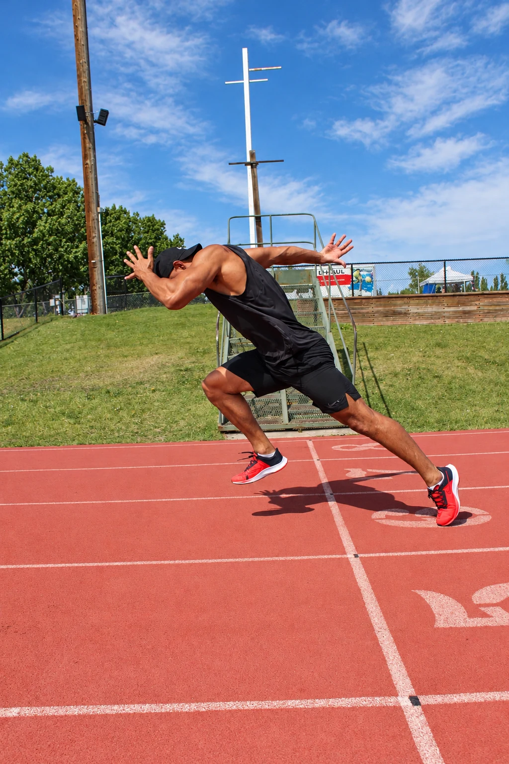 Davidson sprinting on a red athletics track