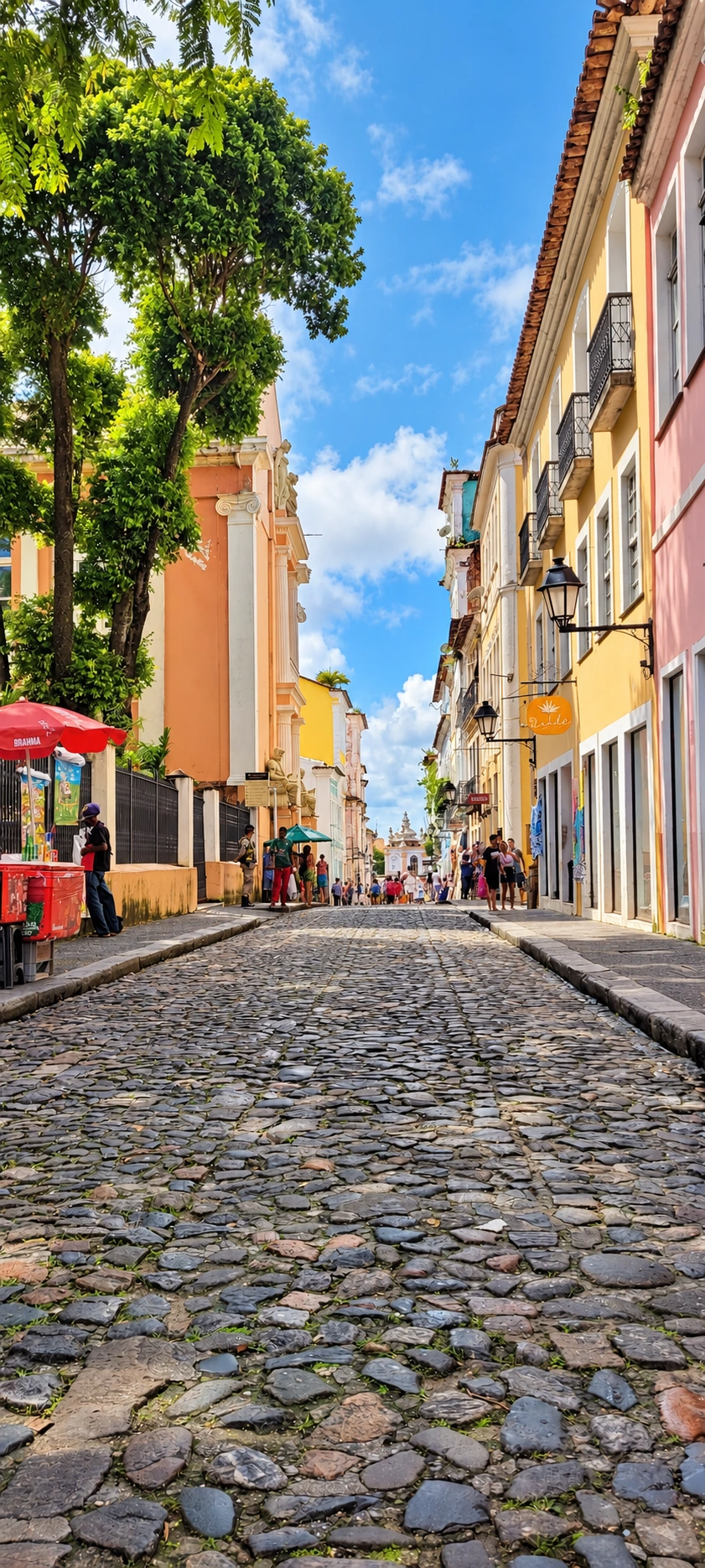 Pastel historic buildings and cobblestone street in Bahia, Brazil