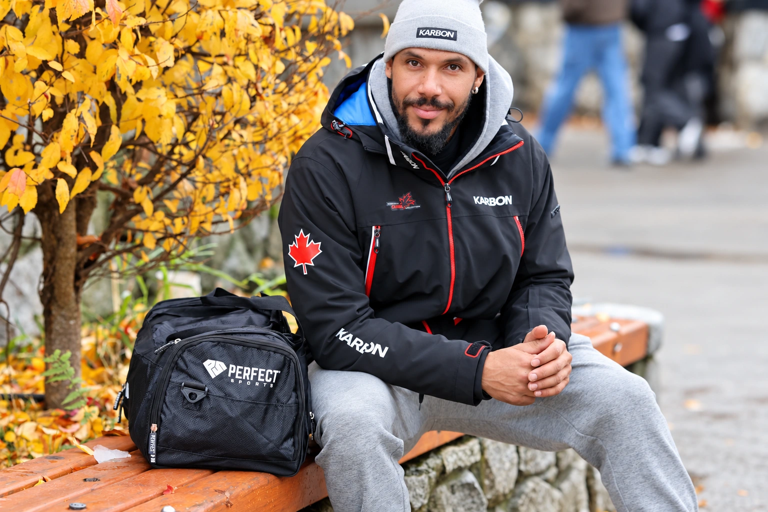 Davidson beside autumn foliage with a Perfect Sports bag